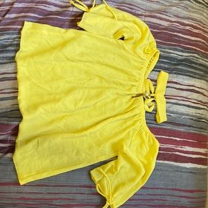 The brand is a Colombian business and the yellow is lighter. It’s a size medium.